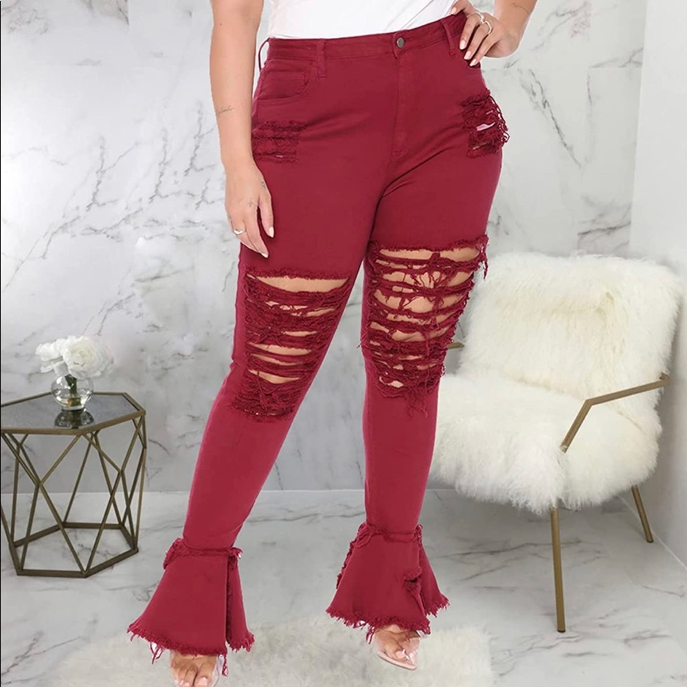 Ripped Bell Bottom Jeans. True to size.